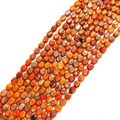 Polished oval Imperial Stone beads in red and orange with natural marbled texture - 7X9mm / Orange Red Spotted (No.5)
