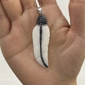 Elegant shell feather pendant with black stones and diamond accents on a metal loop - No. 4 (25x68mm)
