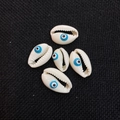 Five evil eye printed cowrie shell beads for DIY jewelry on a black textured background - 12x20mm / 20 Pieces Set / Light Blue