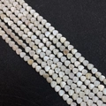 Macro detail of heart-shaped natural shell beads with pearl luster for DIY jewelry - Straight Hole Heart Style / 8mm
