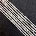 Macro detail of cylindrical natural mother of pearl beads for DIY jewelry making - Cylinder Style / 3x6mm