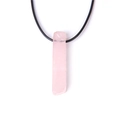 Macro shot of natural rose quartz stone column pendant with black braided cord necklace - Rose Quartz