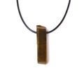 Detailed macro view of the rectangular tiger eye stone pendant on a black cord necklace - Yellow Tiger Eye