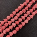 Pink synthetic coral pig-shaped beads for DIY jewelry making in a vibrant glossy finish - Laughing Buddha Shape / 12mm (50 Pieces/Pack)