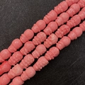 Pink synthetic coral carved face beads for DIY jewelry making and handicraft designs - Wukong Style / 10x16mm (50 Pieces/Pack)