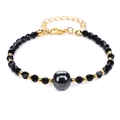 Minimalistische kralenarmband met 4mm zwarte gefacetteerde stenen en gouden sluiting - Goudglans Obsidiaan
