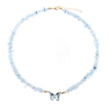 Detailed macro view of light blue gemstone bead necklace with a blue butterfly pendant - Light Blue