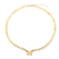 Close-up of yellow crushed stone beaded necklace featuring a sparkling gold butterfly charm - Yellow