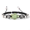 Detail of hand-woven turtle charm bracelet with marble beads and adjustable black cord - Light Green