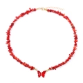 Detailed view of handmade necklace with irregular red stone beads and butterfly pendant - Red