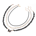 Detailed macro view of triple-layered necklace with black stone beads and butterfly pendant - Black (FN1541)