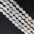 Macro shot of oval natural mother of pearl shell beads with iridescent white gloss finish - Oval / 9x12mm / Pearl White