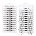 Detailed macro view of 12 zodiac constellation beaded woven rope bracelets on white card - Woven Style