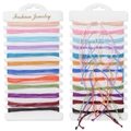 Detail view of 12 colorful braided cord bracelets displayed on fashion jewelry card - Multi-Color Wax Rope Style (FK1874) / Woven Style