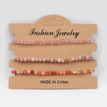 Three-piece stackable beaded natural stone bracelets in pink and purple on card - Red Watermelon Red Striped Red Plum Blossom