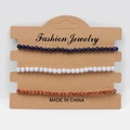 Three-piece set of 4mm natural stone beaded bracelets in blue, white, and brown on card - Blue Goldstone White Turquoise Goldstone