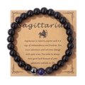 Bracciale Sagittario con perle nere lucide e pietra lavica su scheda di supporto - Sagittario / 19cm