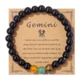 Bracciale segno Gemelli con perle nere lucide e pietra occhio di tigre su carta kraft - Gemelli / 19cm