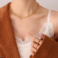 Layered 18K gold plated titanium chain necklace and stackable rings set on model - Gold Paperclip Link Chain