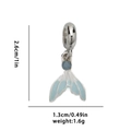 Detailed view of silver mermaid tail pendant with blue enamel and small gemstone - Blue Fish Tail