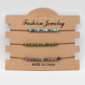 Set di tre braccialetti intrecciati con perline da 4 mm e pietre naturali su carta kraft - Stile Perline Miste Multicolore (FD9940)
