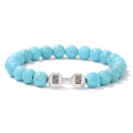 Macro shot of turquoise stone beads with silver dumbbell charm featuring LIFT engraving - 19cm / Turquoise