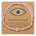 Handgefertigtes Evil Eye Armband mit rosa Kordel und 18k Goldperlen auf Geschenkkarte - Rosa