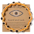 Orange and black evil eye beaded bracelet with gold spacers on cardboard display - Orange Black