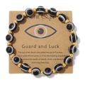 Retro Evil Eye beaded bracelet with 18k gold beads on brown gift display card - Black & White Stripes