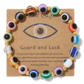 Colorful Evil Eye beaded bracelet with 18k gold spacers on a vintage kraft card - Multicolor Style