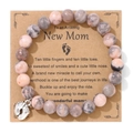 Pink Rhodonite and Zebra Stone beaded bracelet with silver baby footprint charm on gift card - Zebra Stone
