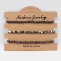 Three-piece beaded bracelet set with black, agate, and brown stone textures on a display card - Black Peacock Black White Zebra Snowflake Obsidian