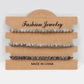 Detail view of 3-piece natural stone bead bracelets set on a brown jewelry display card - White Labradorite Map Stone Flash Stone
