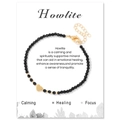 Black faceted beaded bracelet with a golden heart charm on a decorative display card - Black Agate