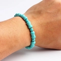 Wrist view of a natural blue turquoise beaded bracelet with unique bone-shaped stones - Sky Blue Bone Shaped Style (03)