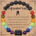 Bracciale Acquario in pietra lavica e perle colorate su carta regalo per aromaterapia - Acquario - Senza Carta