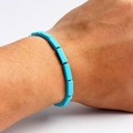 Close-up of rectangular sky blue turquoise bead bracelet worn on a person's wrist - Sky Blue Rectangle Style (07)