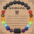 Bracciale Gemelli in pietra naturale con roccia lavica nera e ciondolo zodiacale - Gemelli - Senza Carta