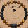 Bracelet zodiaque Taureau avec perles d'oeil de tigre jaune et agate noire sur carte - Taureau