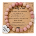 Detail of pink stone beaded bracelet with Love You More heart pendant and aunt gift card - Red Wood Grain Bracelet (To Aunt Card)