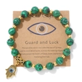 Détail des perles en malachite verte et main de Hamsa dorée avec l'œil protecteur - Style Malachite Verte (CCA177)