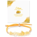 Macro detail of natural citrine stone bracelet with adjustable yellow woven cord - Citrine