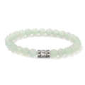 Macro detail of 6mm light green jade beads with engraved silver mantra charm on bracelet - Green Aventurine (CCA706)