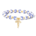 Blue and white porcelain beaded bracelet with a golden bow pendant for women - Vintage Bow Blue Floral Style (CCA914)