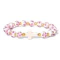 Macro detail of porcelain beads with pink floral patterns and golden spacers on the bracelet - White Cross Pink Floral Style (CCA900)