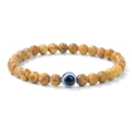 Makroaufnahme von 6mm gelben Steinperlen mit einem blauen Evil-Eye-Schutzarmband - Bildstein Böser Blick (6mm)