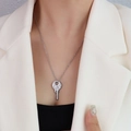 Silver vintage key pendant necklace in polished finish worn on minimalist female neck - Silver Key Necklace - 50+5cm