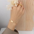 Bracciale in acciaio inossidabile placcato oro 18K con ciondolo Lucky e anelli - Bracciale Dorato (14+5cm)