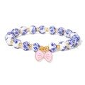 Blue and white porcelain beaded bracelet with a pink enamel bow charm and gold accents - Pink Bow Blue Floral Style (CCA906)