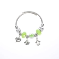 Detail of silver wire bracelet with green beads, frog charm and elephant pendants - Green